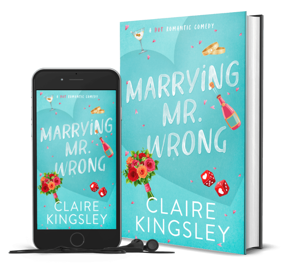 The book cover for Marrying Mr Wrong, a hot romantic comedy by Claire Kingsley, is a teal background with illustrated images of a bought of roses, red dice with hearts, a champagne bottle, wedding bands and a martini glass. Next to the book is a phone showing the cover with a pair of wired earbuds.