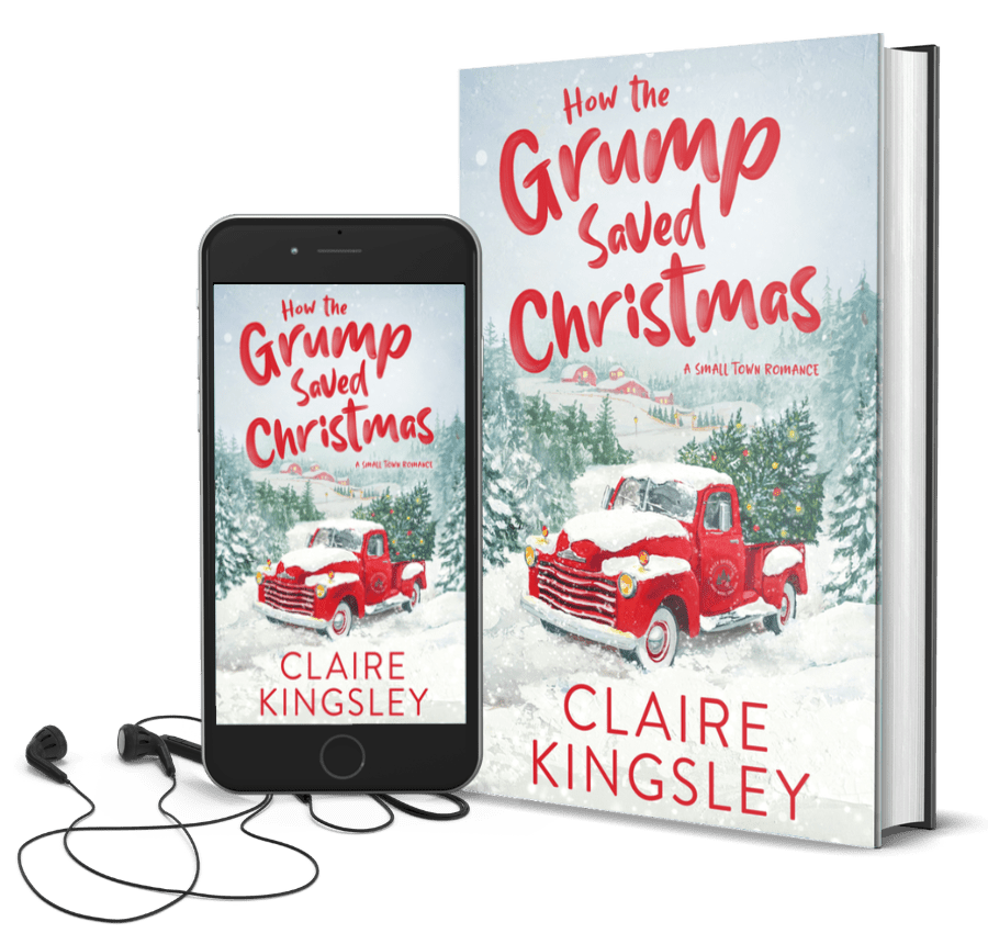 The book cover for How the Grump Saved Christmas, a small-town romance by Claire Kingsley, is an illustrated image of an old red pick up truck in the snow surrounded by pine trees and a farmhouse off in the distance. There are Christmas trees in the bed of the truck and a sign on the driver's door that says "Bailey Brothers, Hard Wood, Long Rail". Next to the book is a phone showing the cover with a pair of wired earbuds.