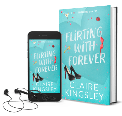 The book cover for Flirting With Forever, a hot romantic comedy by Claire Kingsley, is a teal background with illustrated images of black high heels, a red bra, a gold key and a martini glass. Next to the book is a phone showing the cover with a pair of wired earbuds.