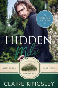 The bonus epilogue book cover for Hidden Miles, a small-town romance by Claire Kingsley, is an image of a man in a black coat with long dark hair turned looking over his shoulder with a furrowed brow, a forest of trees in the background. There are shades of green and white.